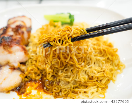 Egg noodle with roasted red pork 42377605