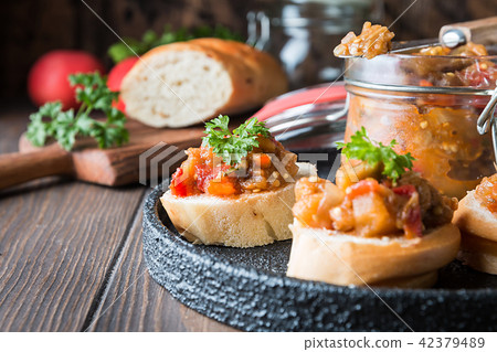 Bread toasts with eggplant caviar. Bread toasts with eggplant caviar. 42379489
