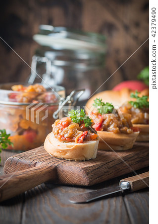 Bread toasts with eggplant caviar. Bread toasts with eggplant caviar. 42379490