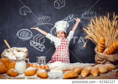 Adorable little girl in chef hat Adorable little girl in chef hat 42382127