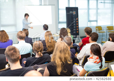 Speaker giving presentation on business conference. Speaker giving presentation on business conference. 42382680