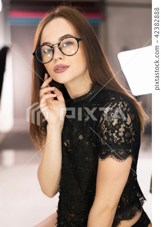 Sexy young girl in lace top in photo studio view 42382888