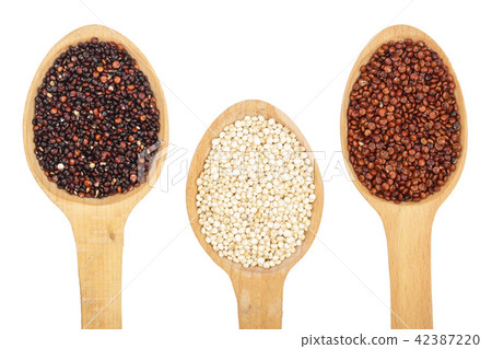 Black red white quinoa seeds in wooden spoon isolated on white background. Top view 42387220