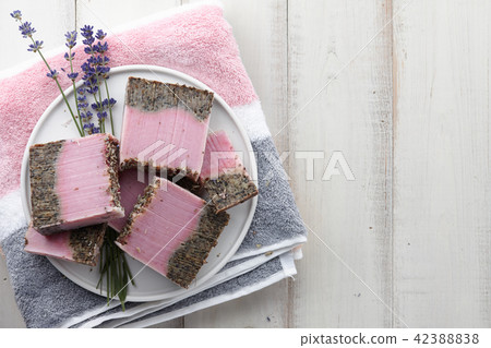 Handmade lavender soap on white planks Handmade lavender soap on white planks 42388838