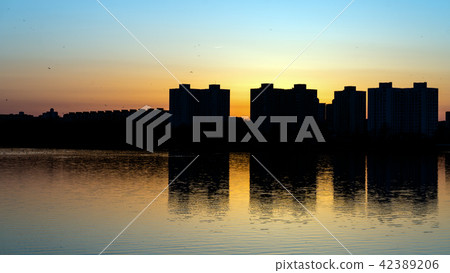 Sunset over lake in Minsk, the Chizhovka district. Belarus Sunset over lake in Minsk, the Chizhovka district. Belarus 42389206