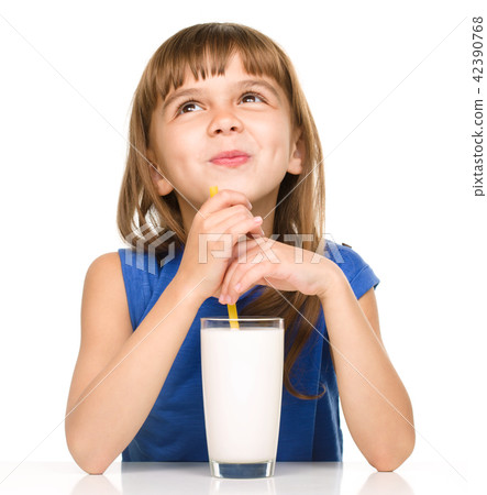 Cute little girl with a glass of milk 42390768