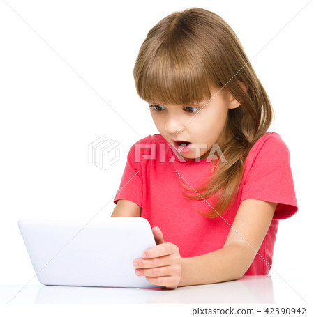 Young girl is using tablet 42390942