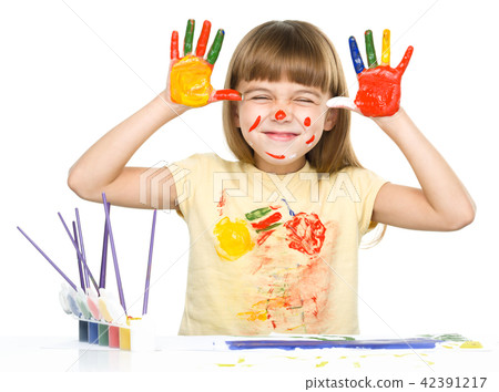Portrait of a cute girl playing with paints Portrait of a cute girl playing with paints 42391217