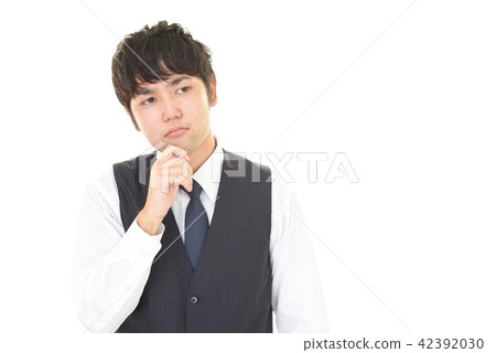 An agonizing businessman An agonizing businessman 42392030