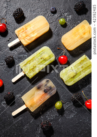 Photo of ice cream on stick, blackberry ,cherry, gooseberry Photo of ice cream on stick, blackberry ,cherry, gooseberry 42392485