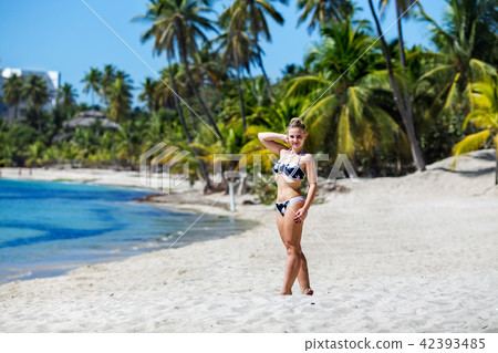Young woman on tropical beach 42393485