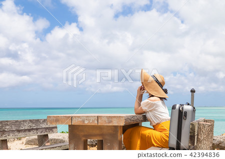 A young woman who enjoys traveling in Okinawa A young woman who enjoys traveling in Okinawa 42394836