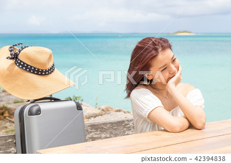 A young woman who enjoys traveling in Okinawa A young woman who enjoys traveling in Okinawa 42394838
