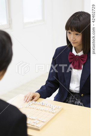 Junior high school students playing go Junior high school students playing go 42402729