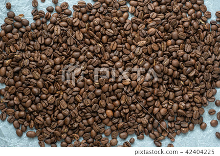 Coffee beans on crumpled paper Coffee beans on crumpled paper 42404225