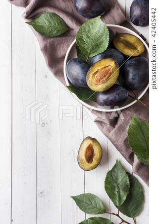 Fresh plum berries on a plate  42405442