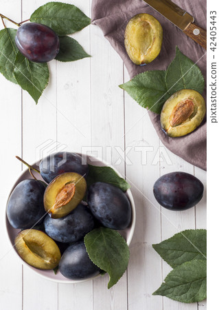 Fresh plum berries on a plate Fresh plum berries on a plate 42405443