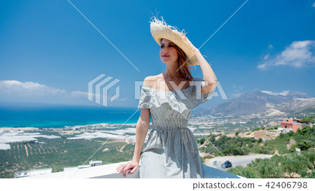 woman is posing on olive garden and sea coast background 42406798