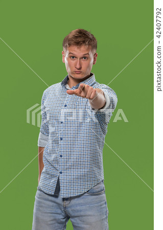 The overbearing businessman point you and want you, half length closeup portrait on green background The overbearing businessman point you and want you, half length closeup portrait on green background 42407792