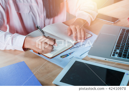 Business woman hands with pen writing notebook 42410978