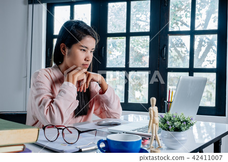 Mature business woman working with laptop Mature business woman working with laptop 42411007