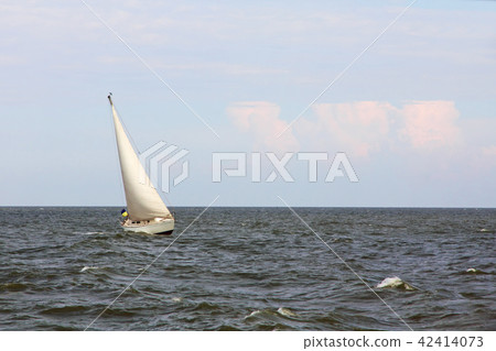 Lonely Sail at sea. 42414073