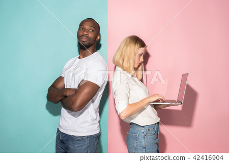 Businesswoman hugging laptop. Love to computer concept. Attractive female half-length front portrait 42416904