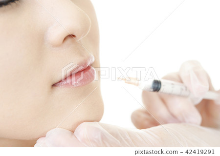 A woman receiving a beauty injection A woman receiving a beauty injection 42419291