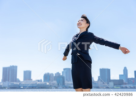 Business woman blue sky 42420986