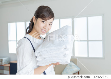 Young lady, housewife, laundry, towel Young lady, housewife, laundry, towel 42422159
