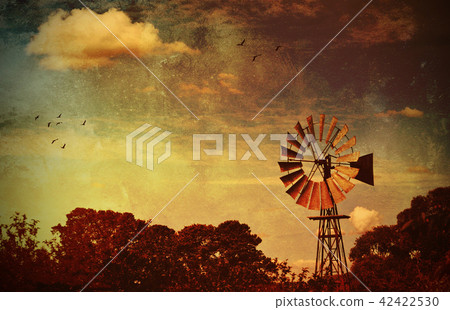 Rustic rural background with windmill Rustic rural background with windmill 42422530