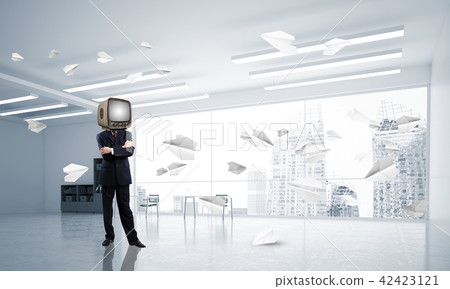 Businessman with an old TV instead of head. 42423121