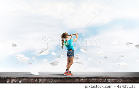 Concept of careless happy childhood with girl exploring this world Concept of careless happy childhood with girl exploring this world 42423135