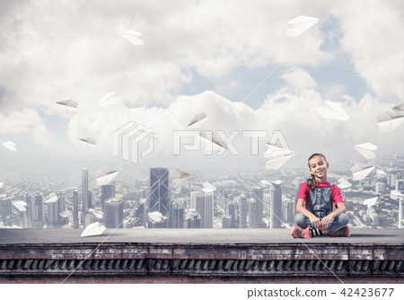 Concept of careless happy childhood with girl of school age smil Concept of careless happy childhood with girl of school age smil 42423677