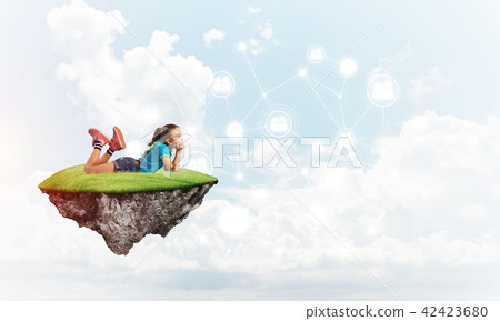 Concept of careless happy childhood with girl dreaming about something Concept of careless happy childhood with girl dreaming about something 42423680