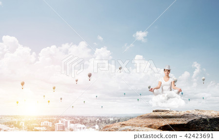 Young woman keeping mind conscious. Young woman keeping mind conscious. 42423691