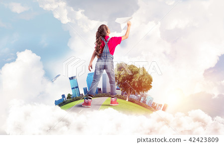 Concept of careless happy childhood with girl dreaming about fut Concept of careless happy childhood with girl dreaming about fut 42423809