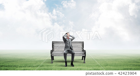 Young man in suit in park dont want to hear anything Young man in suit in park dont want to hear anything 42423904