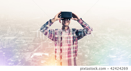 Guy wearing checked shirt and virtual mask demonstrating some em Guy wearing checked shirt and virtual mask demonstrating some em 42424269