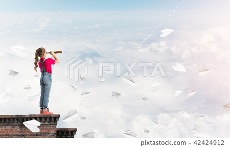 Concept of careless happy childhood with girl exploring this world Concept of careless happy childhood with girl exploring this world 42424912