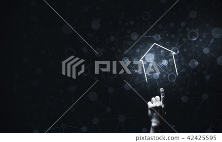 Conceptual image with hand pointing at house or main page icon o Conceptual image with hand pointing at house or main page icon o 42425595