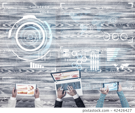 Top view of businesspeople sitting at table and using gadgets 42426427