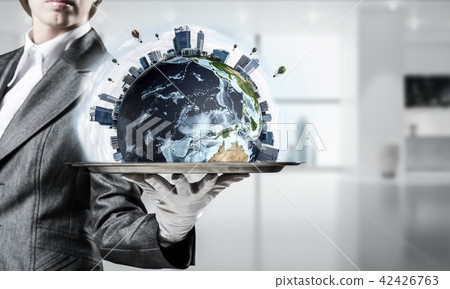 Hand of waitress presenting Earth globe on tray. Hand of waitress presenting Earth globe on tray. 42426763