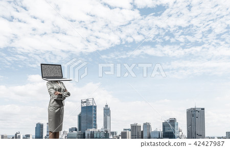 Business woman with laptop instead of head. Business woman with laptop instead of head. 42427987