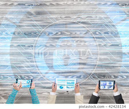 Top view of businesspeople sitting at table and using gadgets 42428134