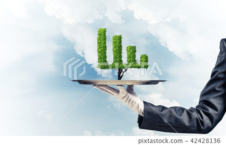 Hand of waitress presenting growing graph on tray. Hand of waitress presenting growing graph on tray. 42428136