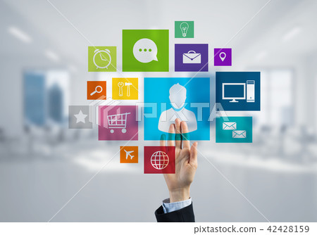 Modern office interior and close of businesswoman hand choosing icon on multimedia interface Modern office interior and close of businesswoman hand choosing icon on multimedia interface 42428159