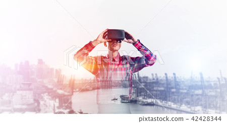 Guy wearing checked shirt and virtual mask demonstrating some emotions Guy wearing checked shirt and virtual mask demonstrating some emotions 42428344