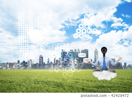 Camera headed man sitting in lotus pose on cloud against modern cityscape 42428472