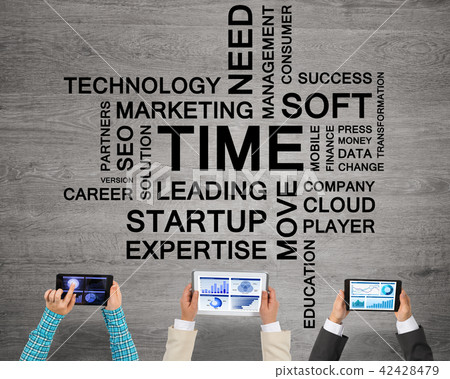 Top view of businesspeople sitting at table and using gadgets 42428479